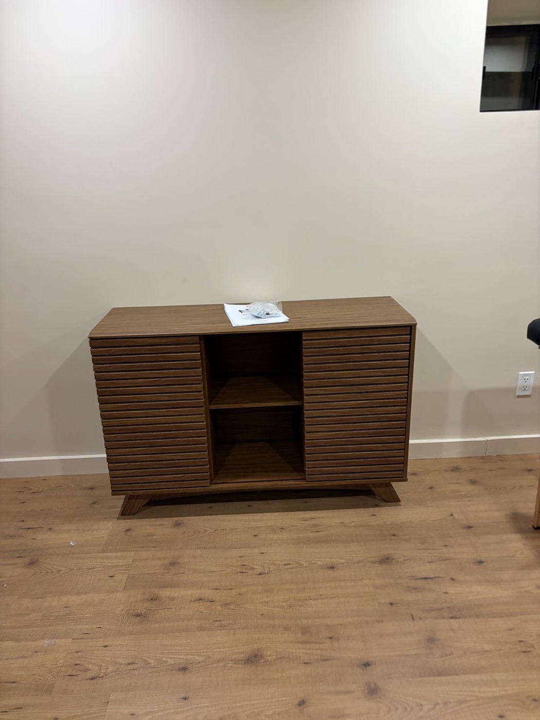 Slatted console assembly in a compact condo living room