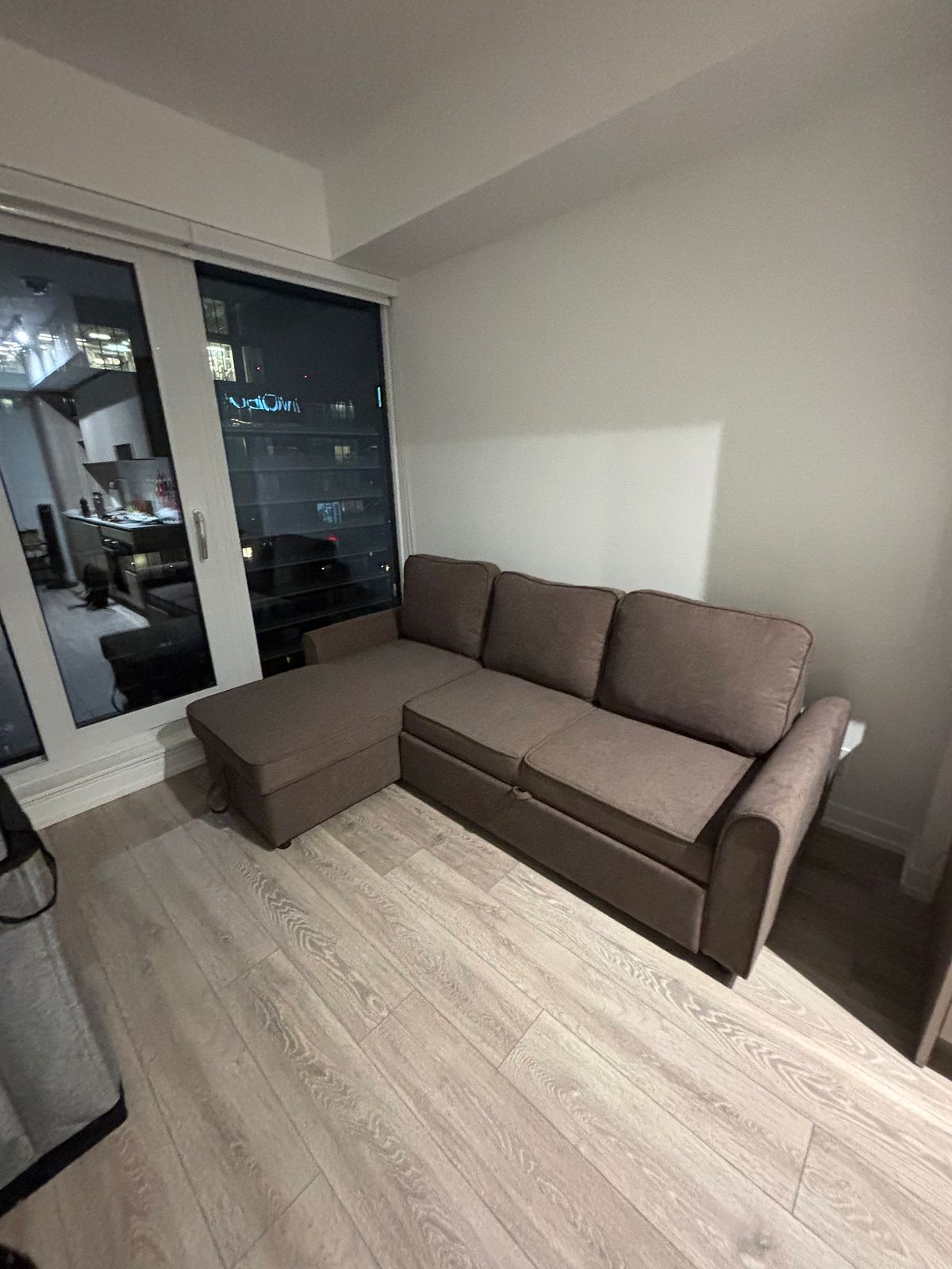 Living room furniture setup in a downtown Toronto condo